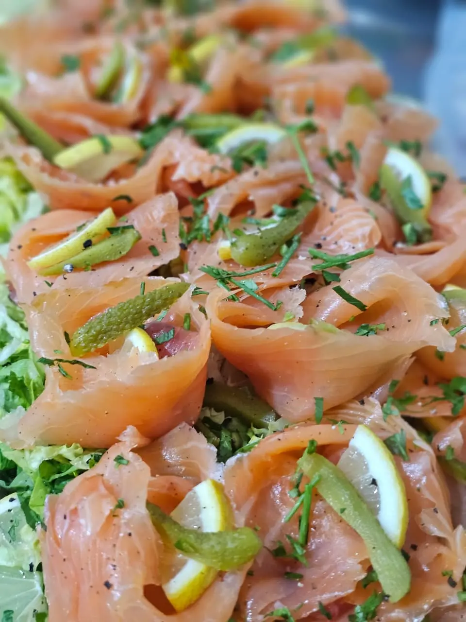 Smoked salmon platter with lemon and herbs