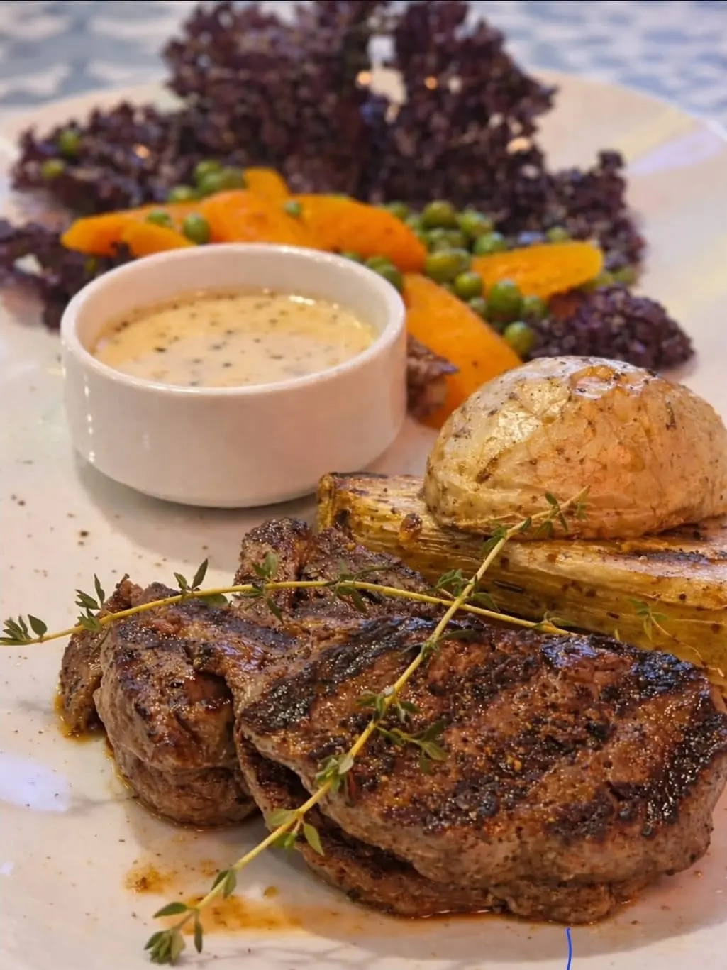 Grilled steak with vegetables and sauce
